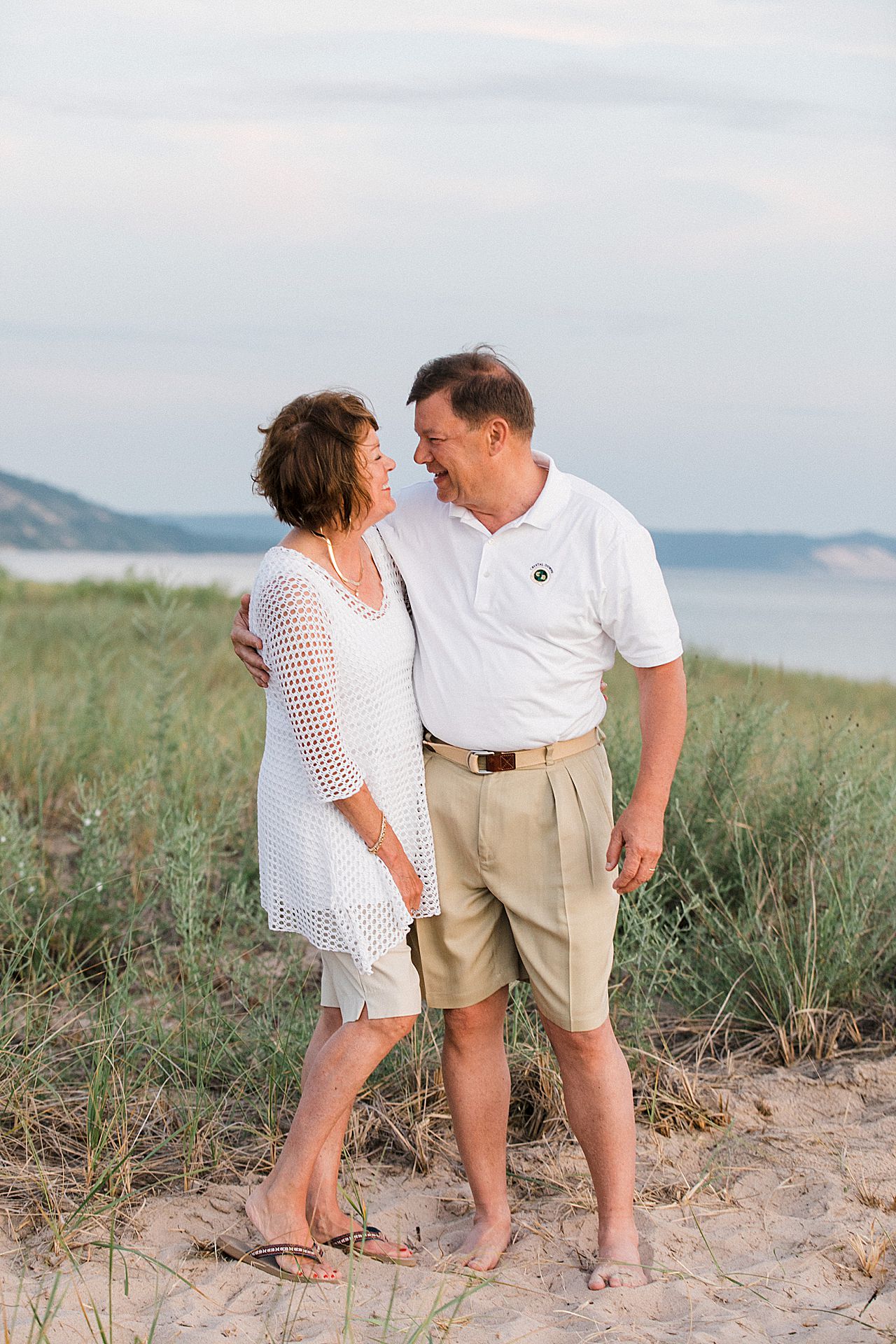 Couple admiring each other on a beach in Northern Michigan