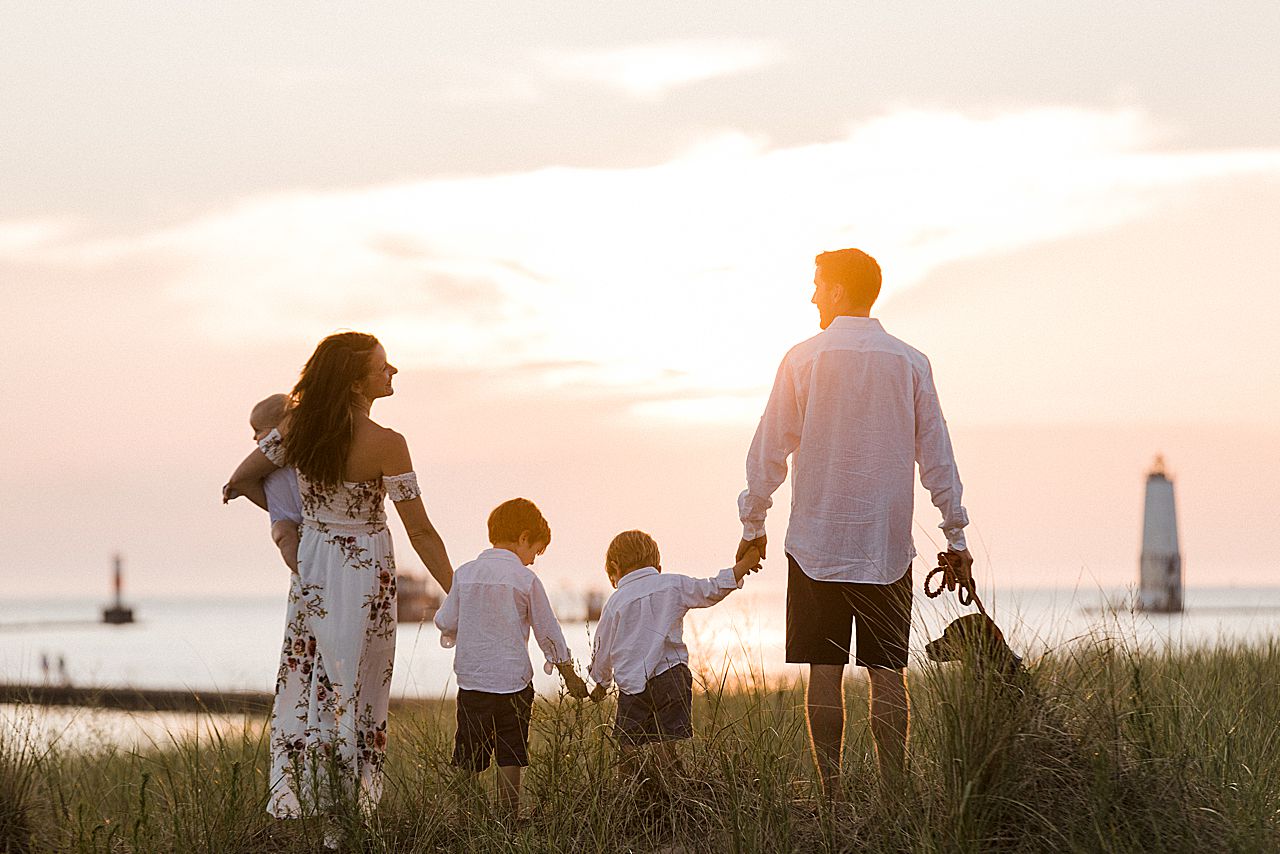 Silhouette of a family during sunset in Frankfort, Michigan