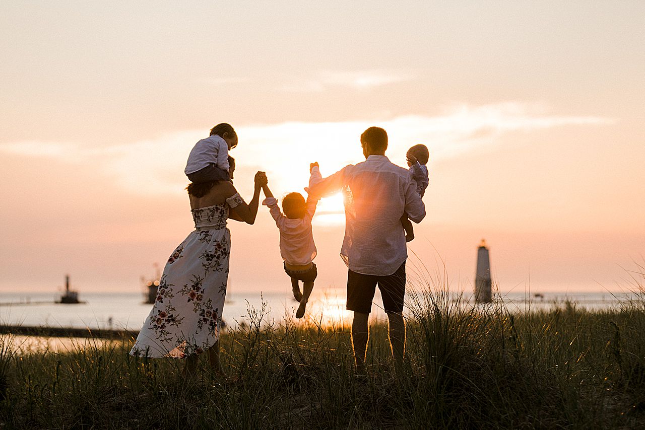 Family watching a sunset in Frankfort, Michigan