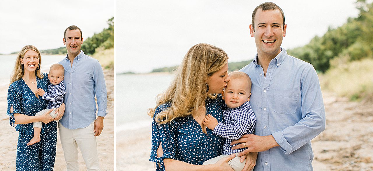 Mother kissing her infant son on the forehead