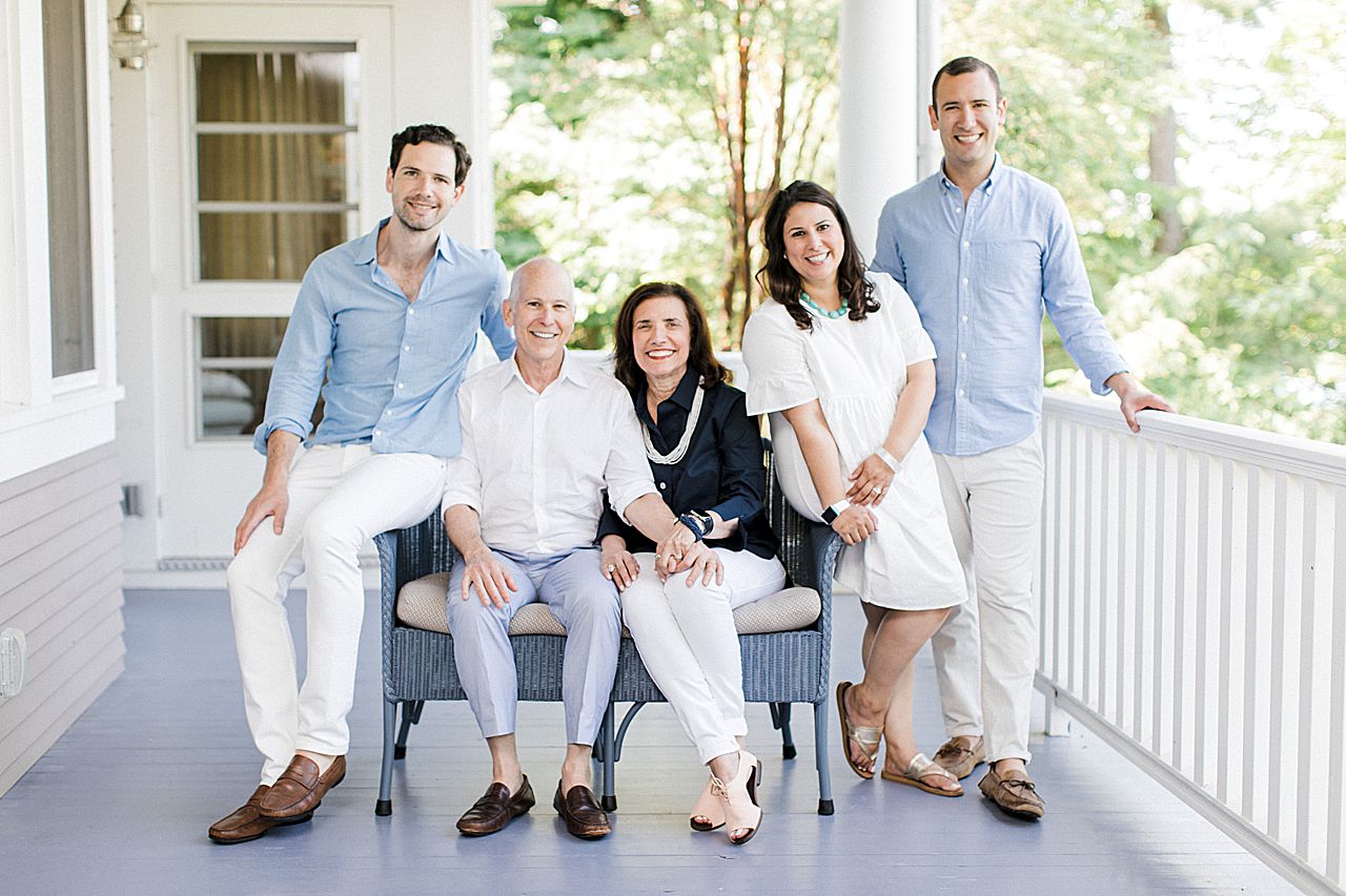 Parents with their grown kids on a porch in Northern Michigan