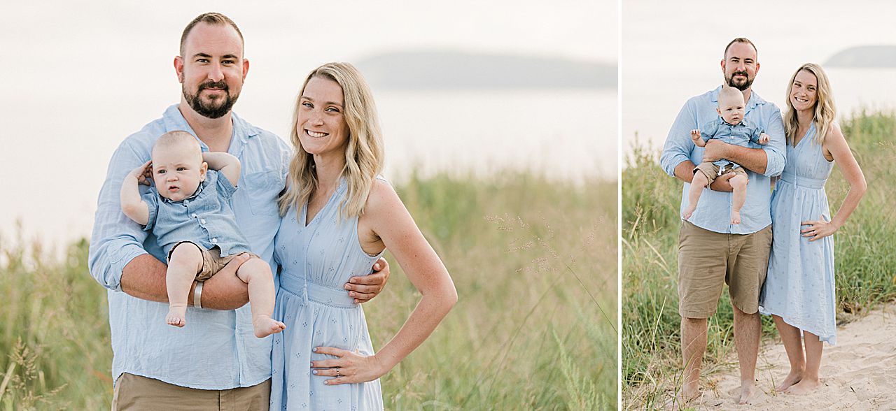 Mother and father holding their baby on a beach
