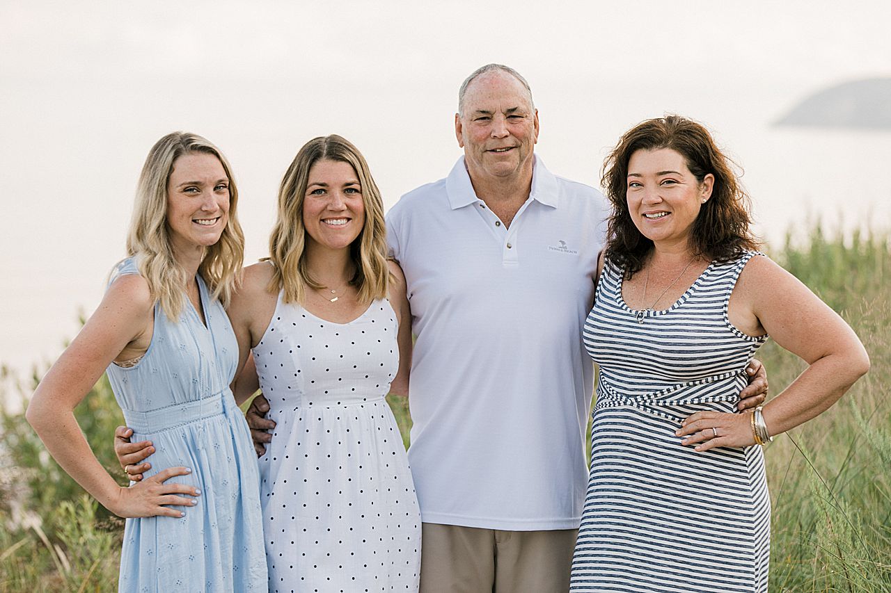 Daughters with their father near Lake Michigan