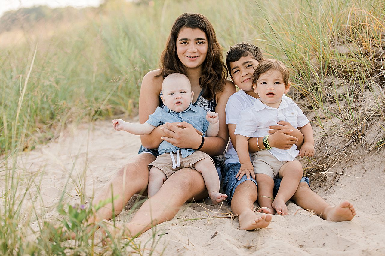 Siblings holding their two young cousins in Northern Michigan