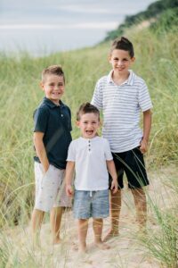 Three young brothers on a beach in Northern Michigan