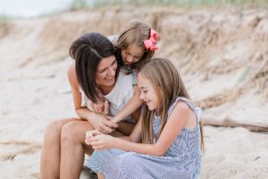 Mother laughing with her two daughters in Northern Michigan