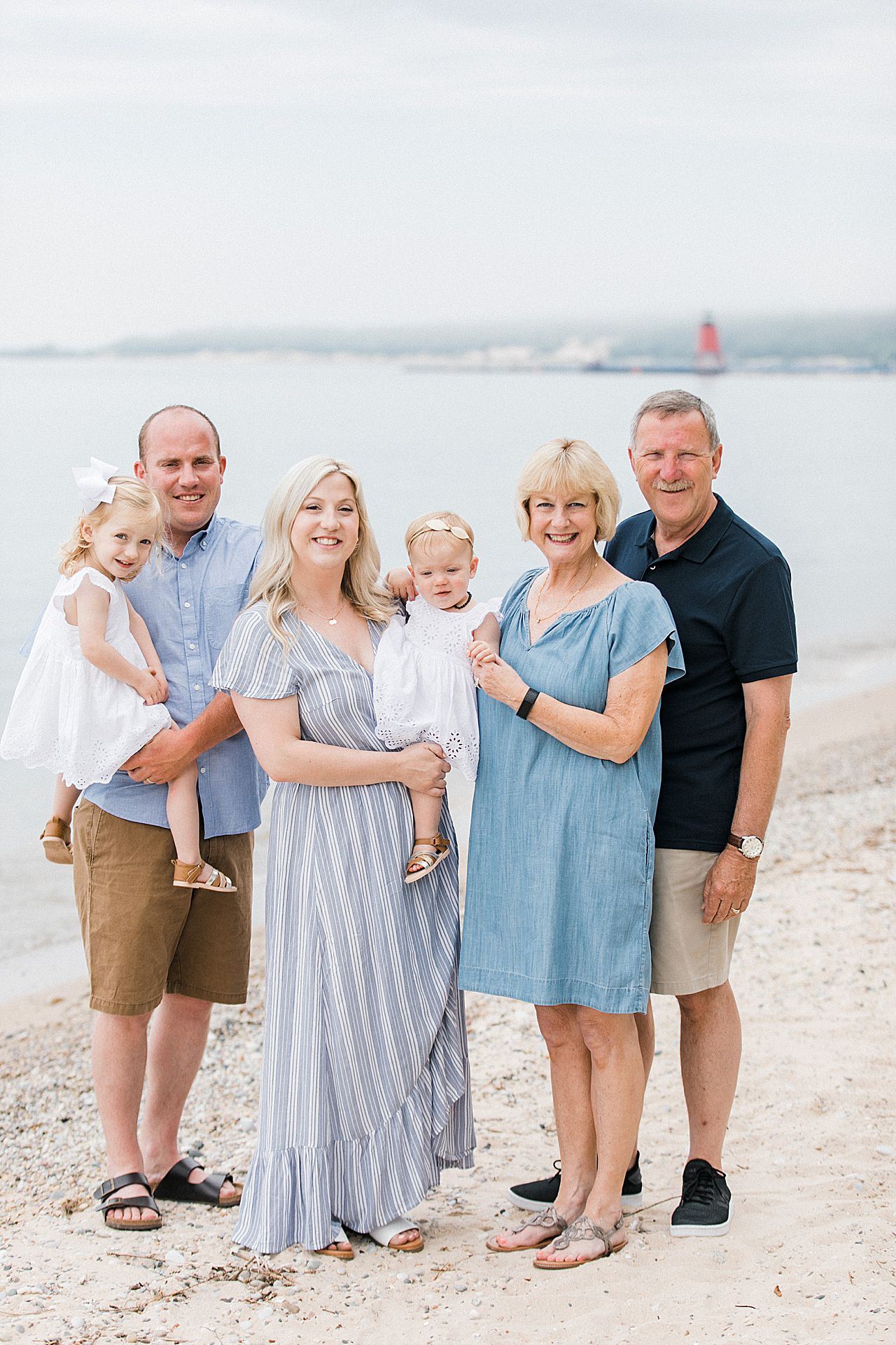 Family posing on a beach in Northern Michigan