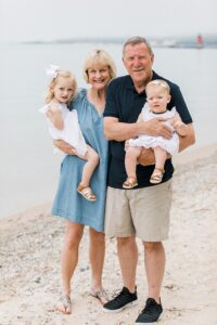 Smiling grandparents spending time with their granddaughters