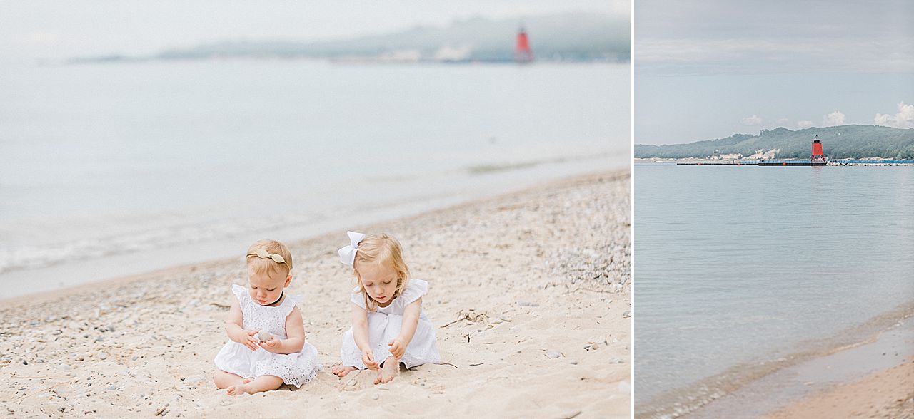 Two young sisters playing in the sand in Charlevoix, Michigan