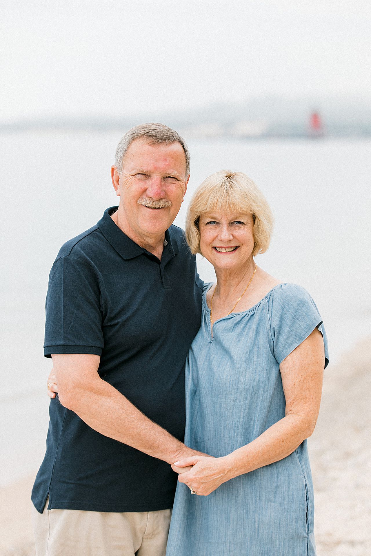 Older couple on a beach in Charlevoix, Michigan