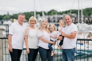 Family portrait next to a marina in Northern Michigan