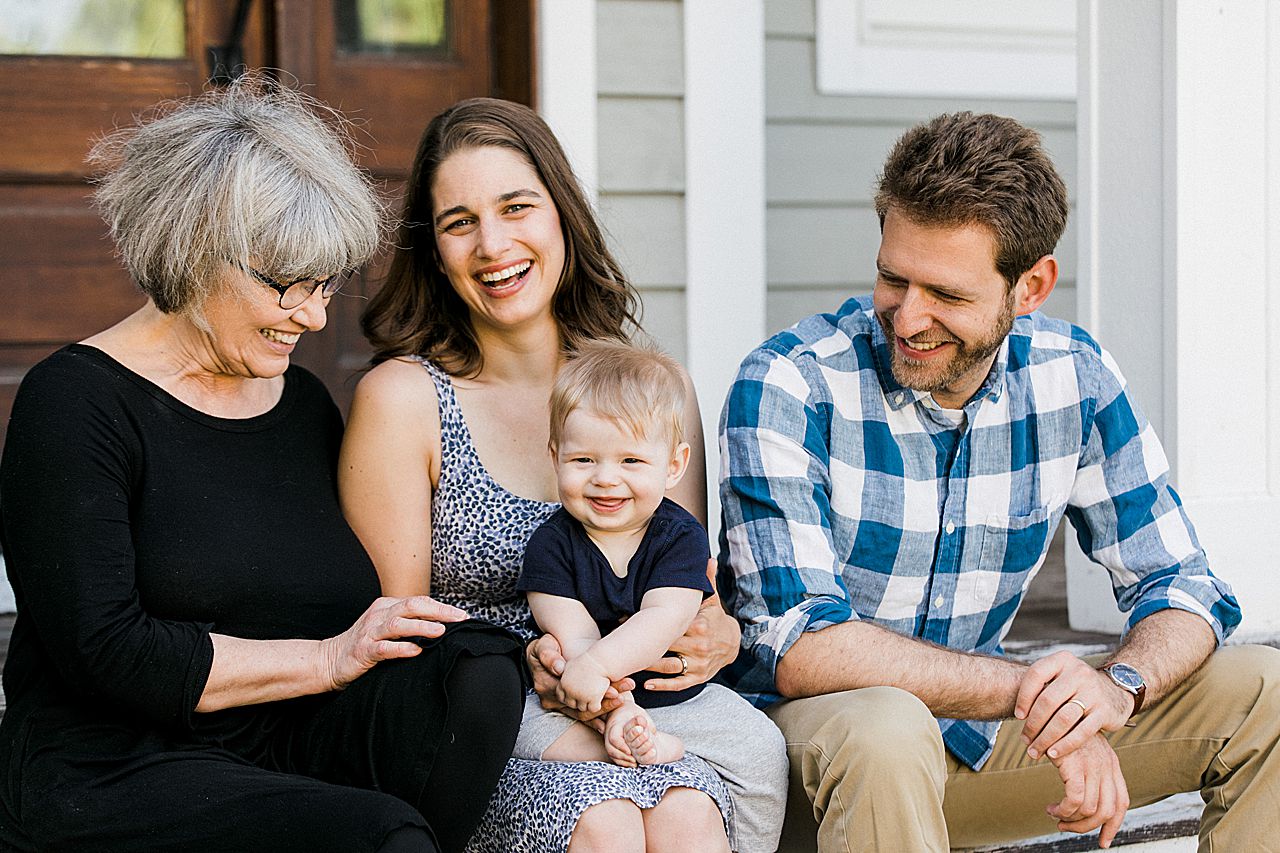 Grandma smiling with her grandson and his parents