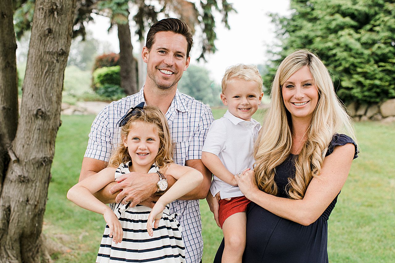 Mother and father holding their daughter and son in Northern Michigan