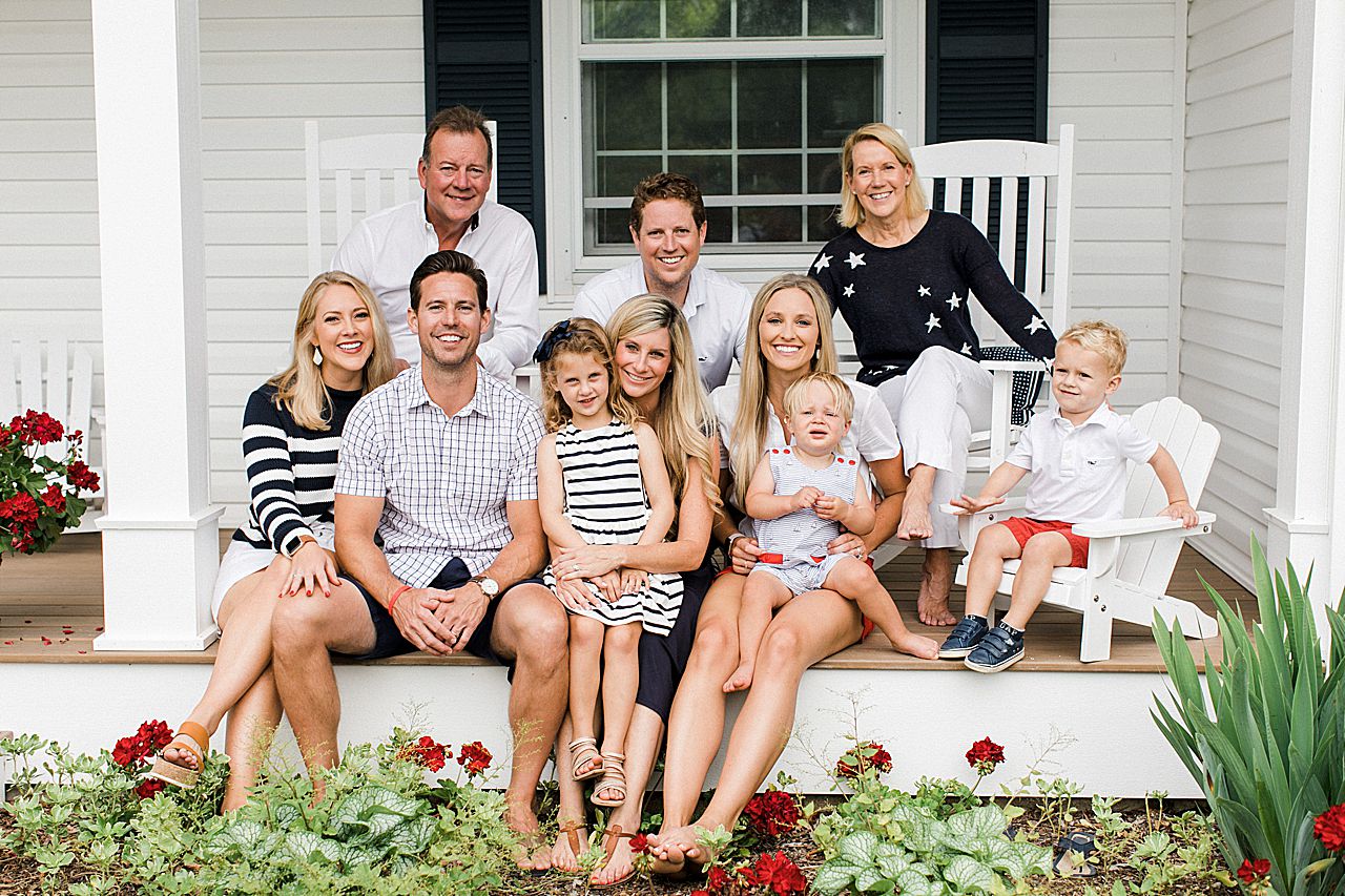 Parents, kids, and grandkids sitting on the porch at their home in Northern Michigan
