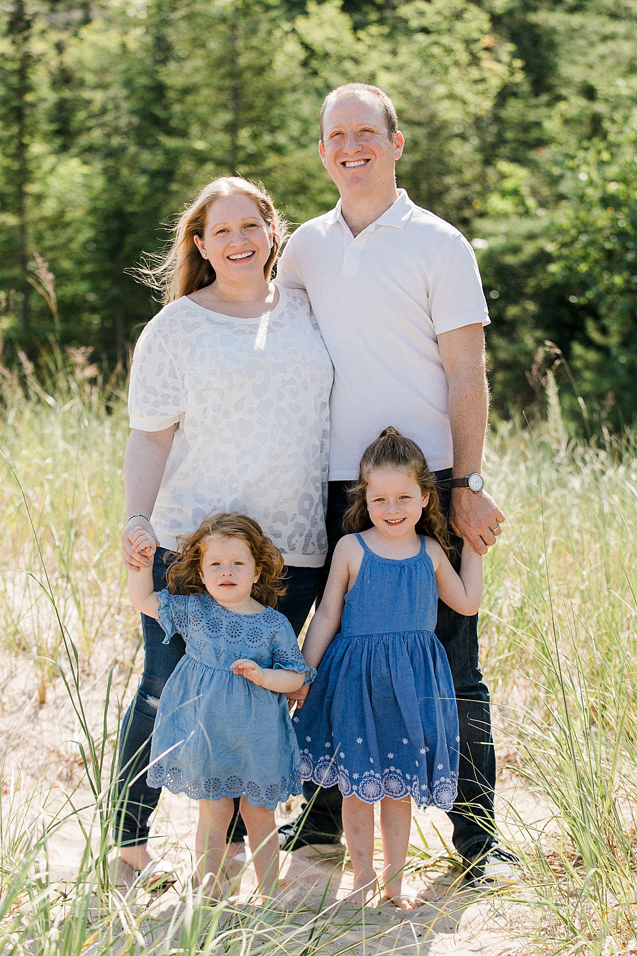 Mother and father with their two young daughters