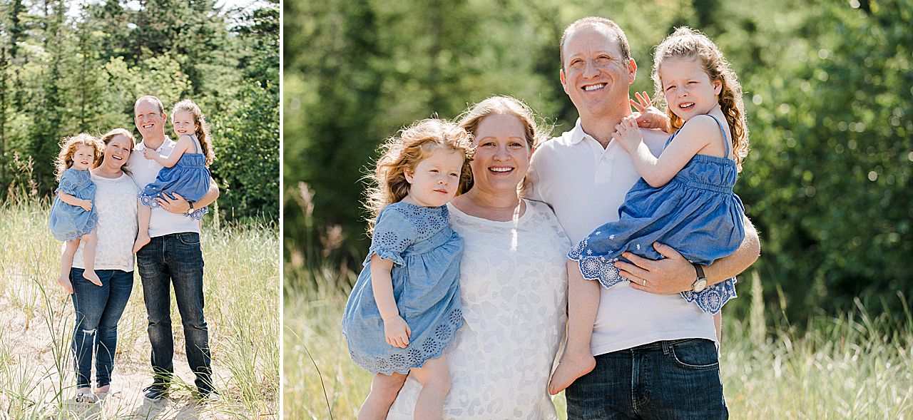 Parents carrying their two young daughters in Northern Michigan