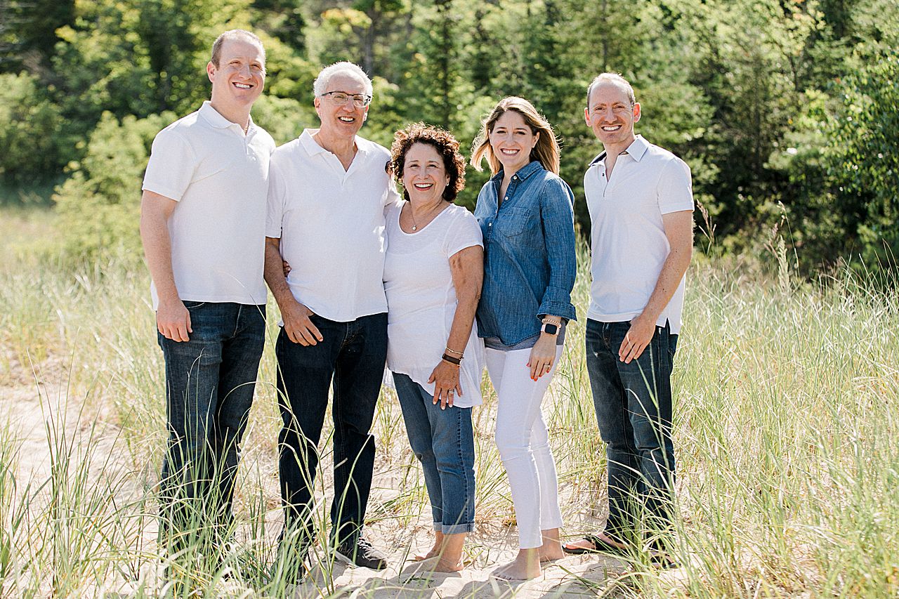 Parents with their grown up kids on a beach in Northern Michigan