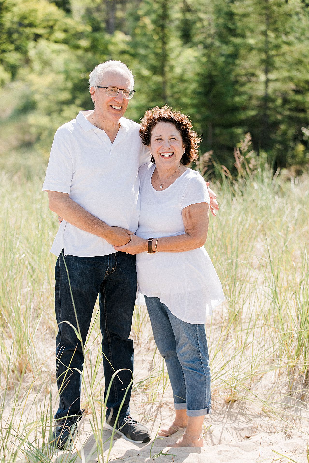 Grandparents together on a beach in Petoskey, Michigan