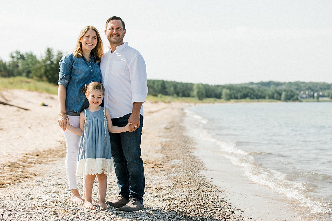 Family of three near the water in Michigan