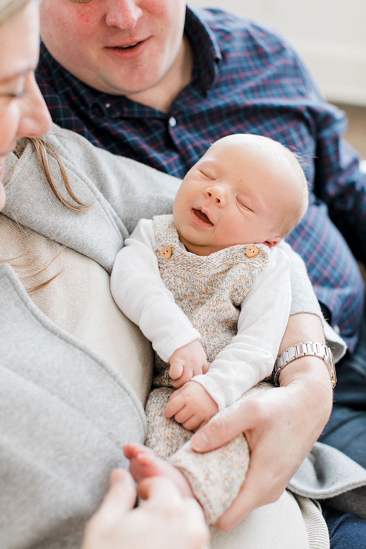 Parents holding their new baby in Northern Michigan