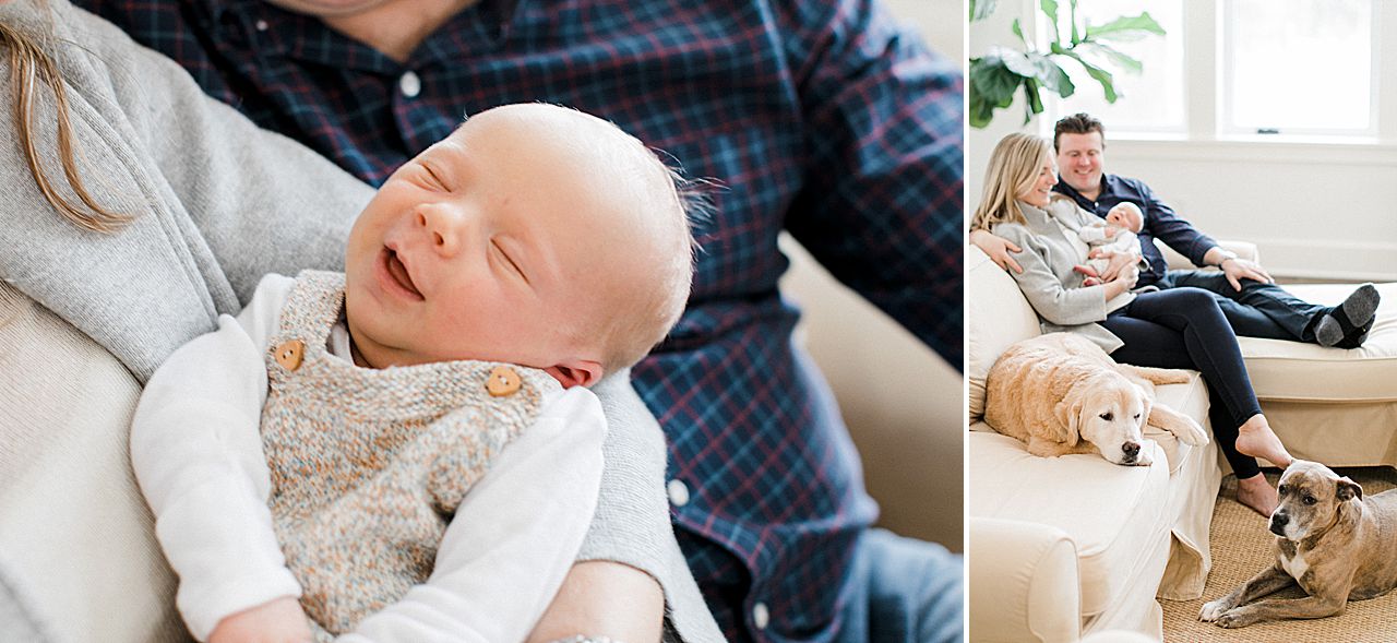 Newborn baby smiling while being held by the parents