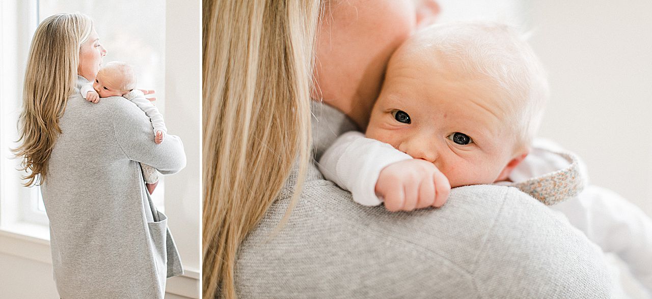 Newborn baby resting on its mother's shoulder