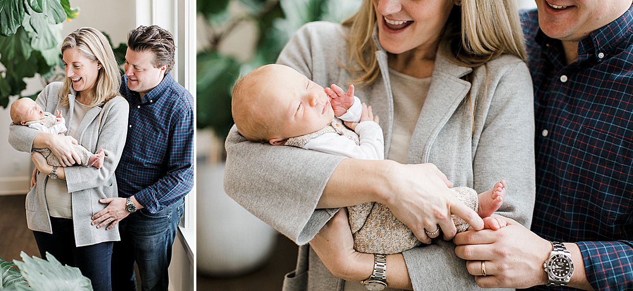 Mother and Father smiling at their newborn in Northern Michigan