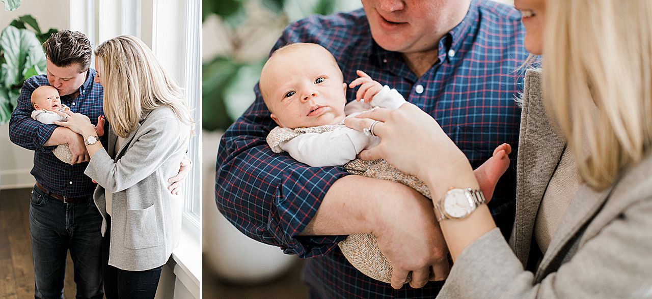 New parents cradling their newborn baby