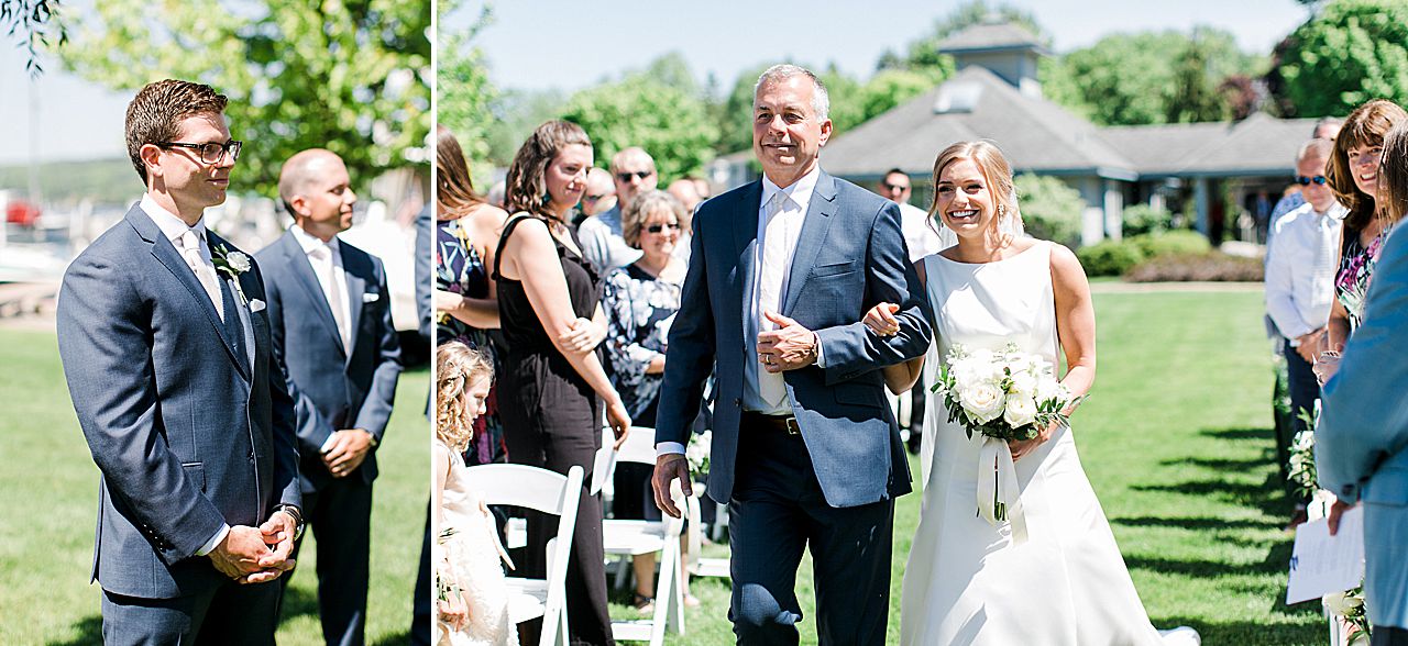 Groom smiling at the bride as she walks down the aisle towards him