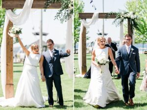 The bride and groom cheering and smiling at guests after kissing at their wedding ceremony