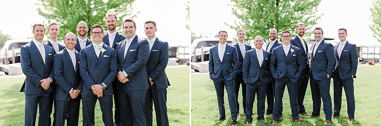 Groom and seven groomsmen smiling for portraits in Northern Michigan