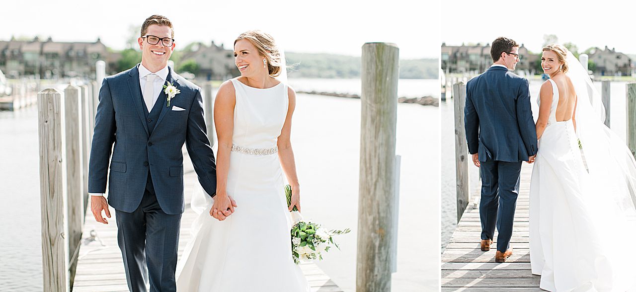 Bride and groom walking and laughing during portraits on Lake Charlevoix in Northern Michigan