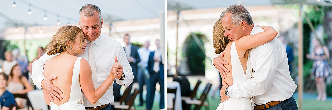 Bride and father of the bride hugging after dancing at a wedding reception in Northern Michigan