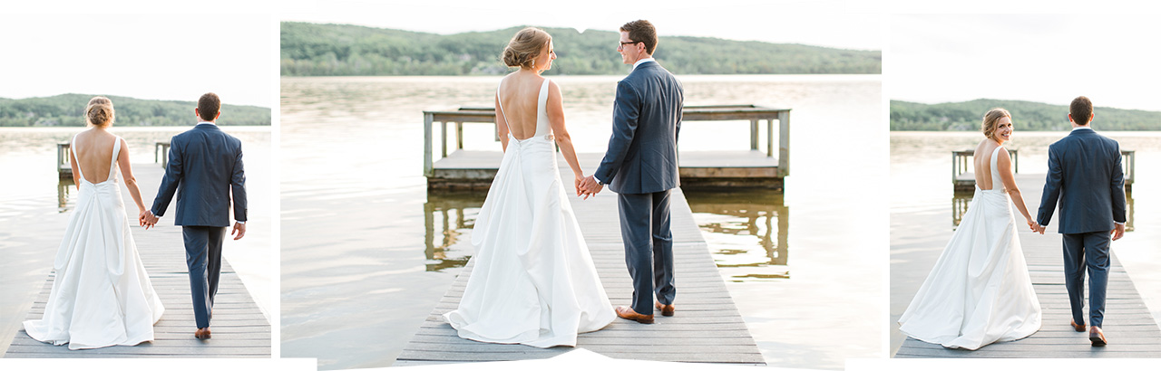 Bride and groom holding hands on a dock on Deer Lake in Northern Michigan