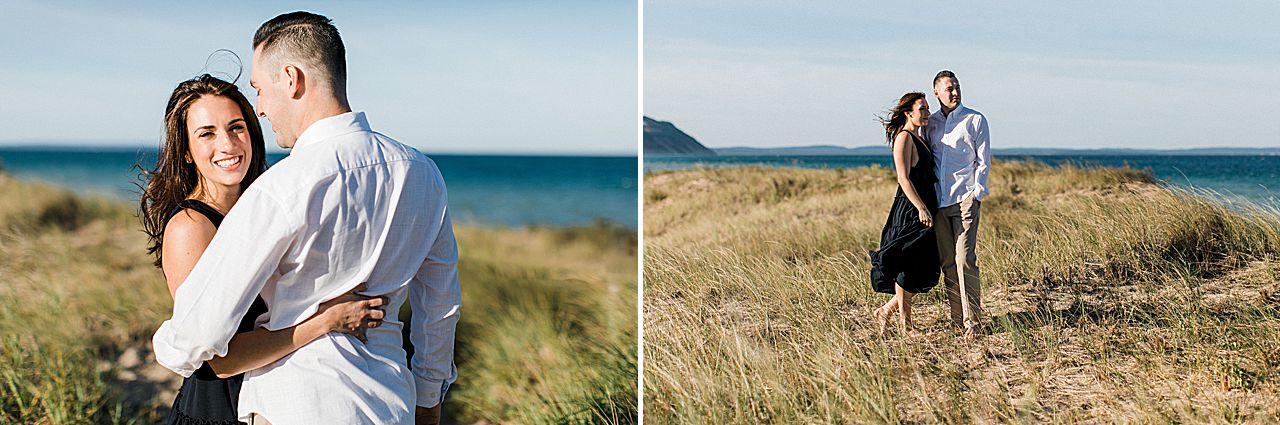 This is a woman with her fiancé in a grassy sand dune by Lake Michigan in Empire, Michigan