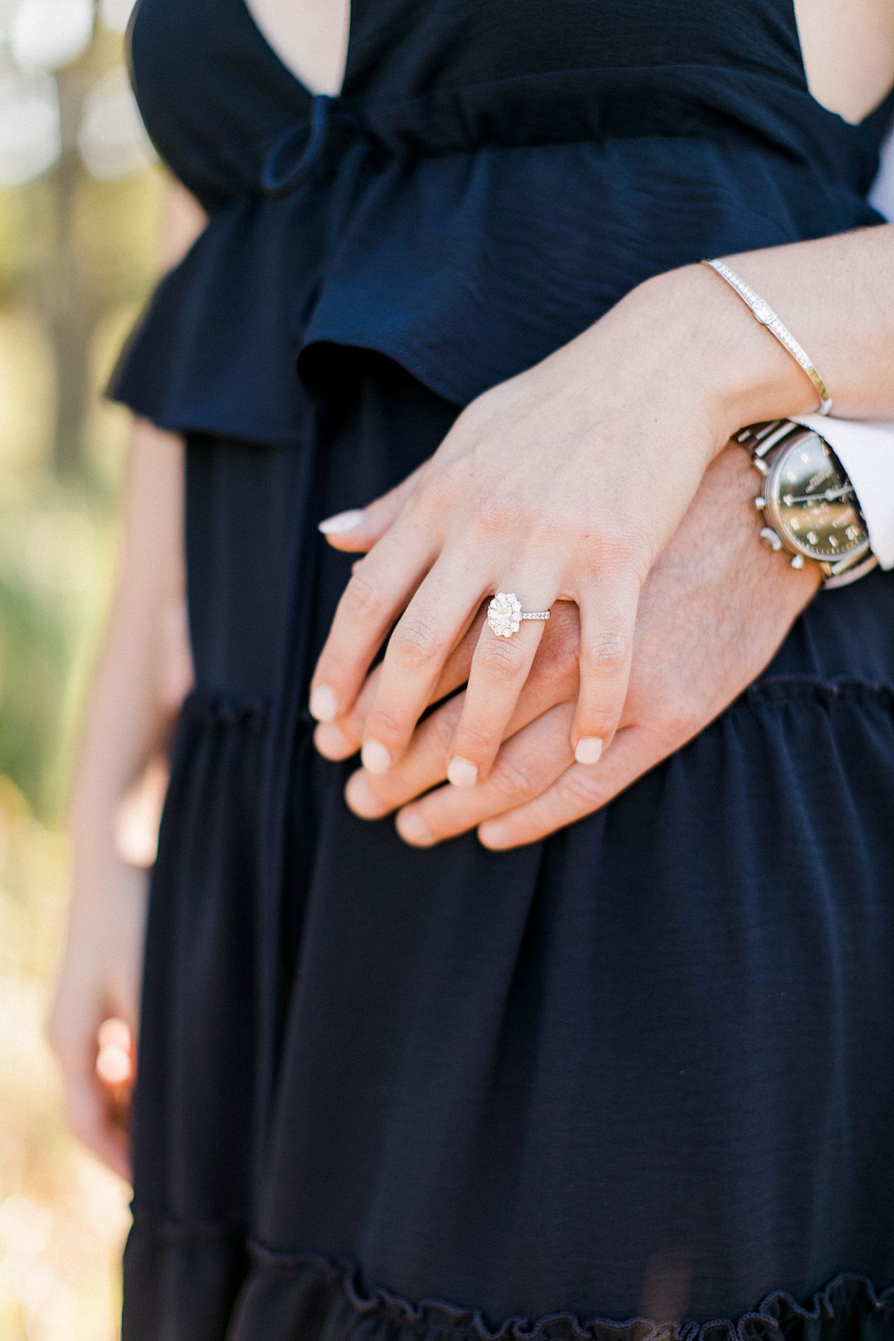 This is a portrait of an oval engagement ring in Empire, Michigan