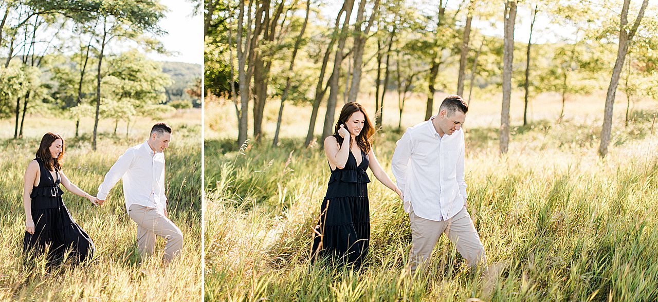 This is a portrait of a couple walking in a grassy field on a sunny day in Michigan