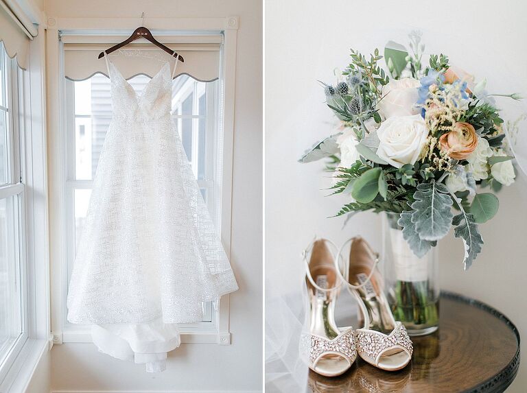 A white wedding dress hanging from a window and bridal shoes and bouquet