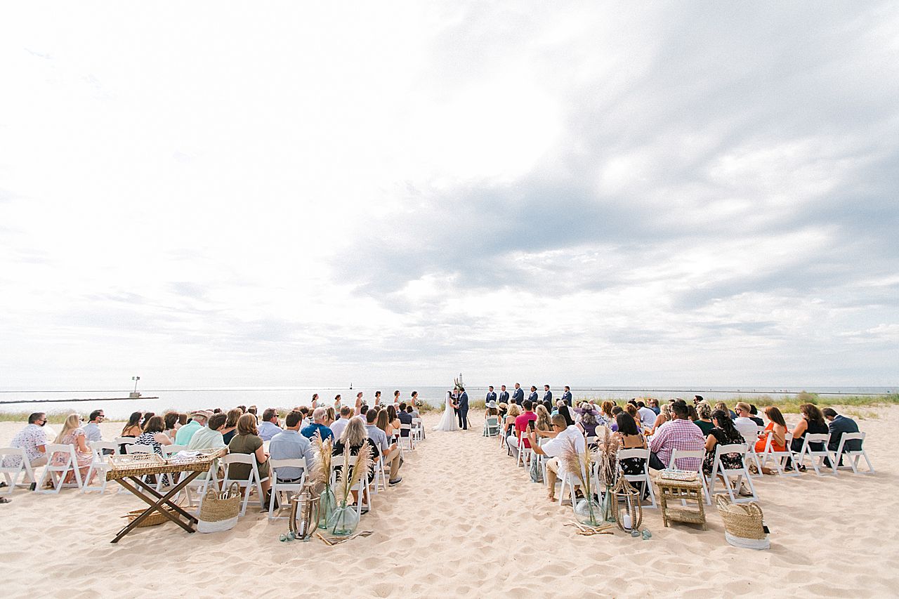 A wedding ceremony on the beach at Harbor Lights Resort in Frankfort, Michigan