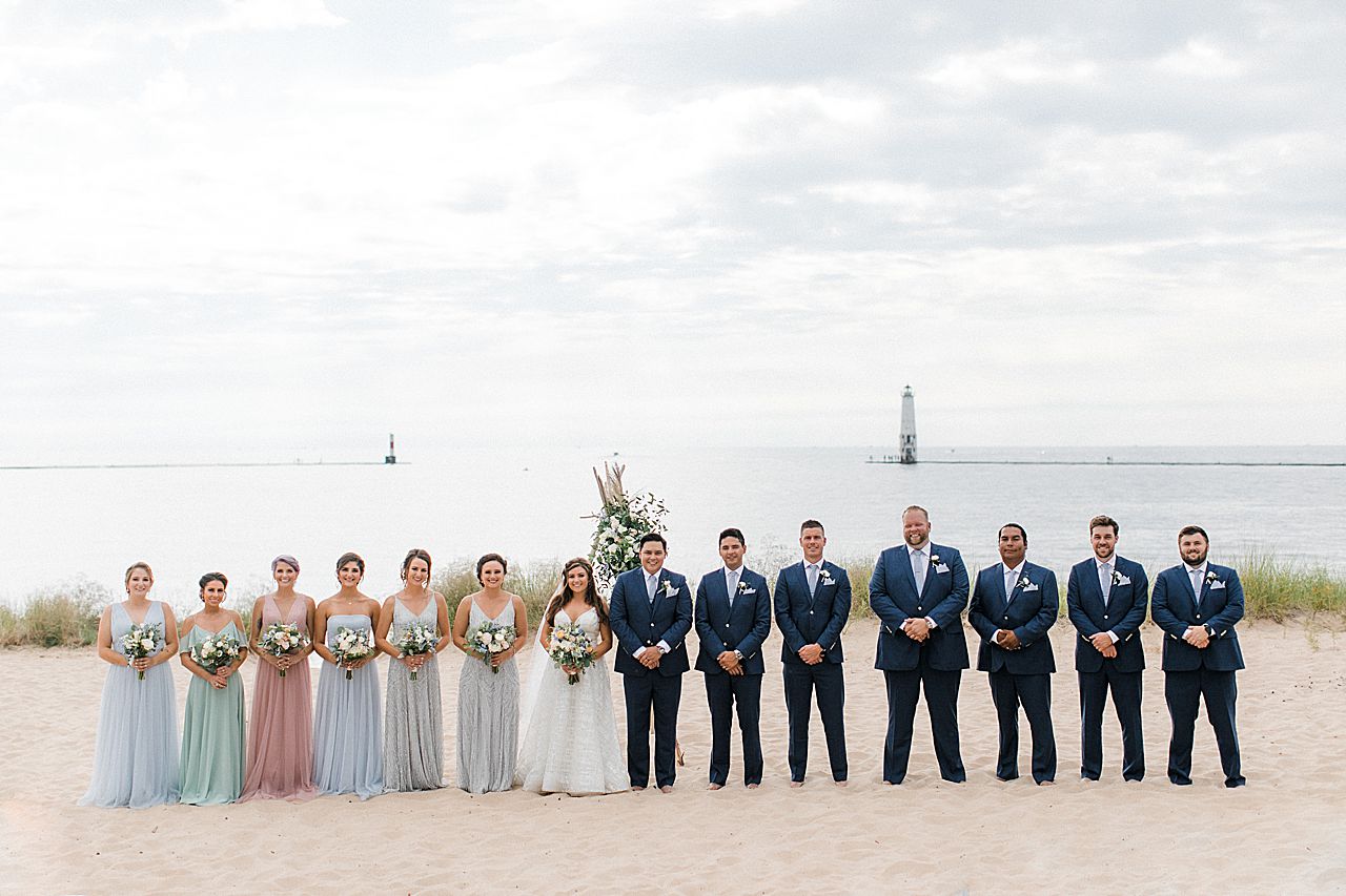 A wedding party on the beach along Lake Michigan in Frankfort, Michigan
