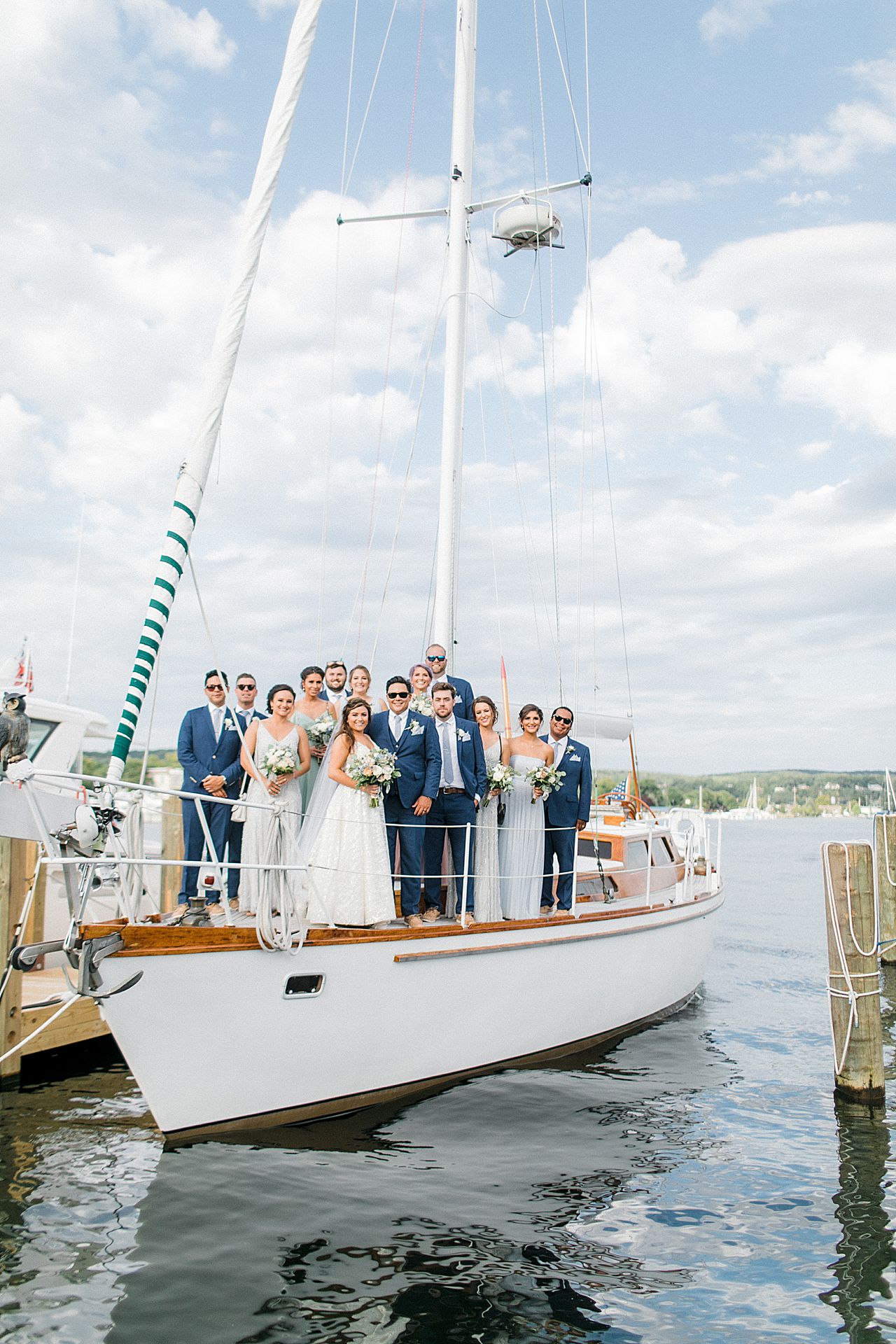 A wedding party on a sailing boat on Lake Michigan in Frankfort, Michigan