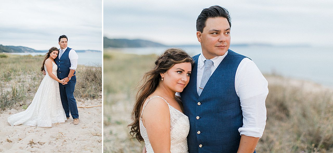A bride and groom looking out at Lake Michigan at sunset in Elberta, Michigan