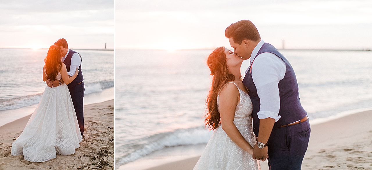 A bride and groom kissing at sunset along Lake Michigan