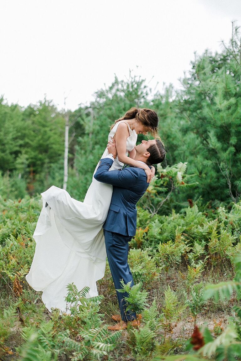 A groom picking up his bride in Leland, Michigan