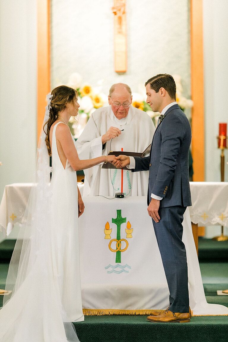 A bride and groom at their wedding ceremony at St Wenceslaus catholic church in Leelanau County, Michigan