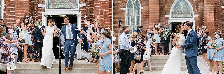 A bride and groom walking out of St Wenceslaus catholic church in Leelanau County, Michigan