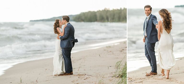 A bride and groom taking portraits on the Lake Michigan shoreline on a very windy day
