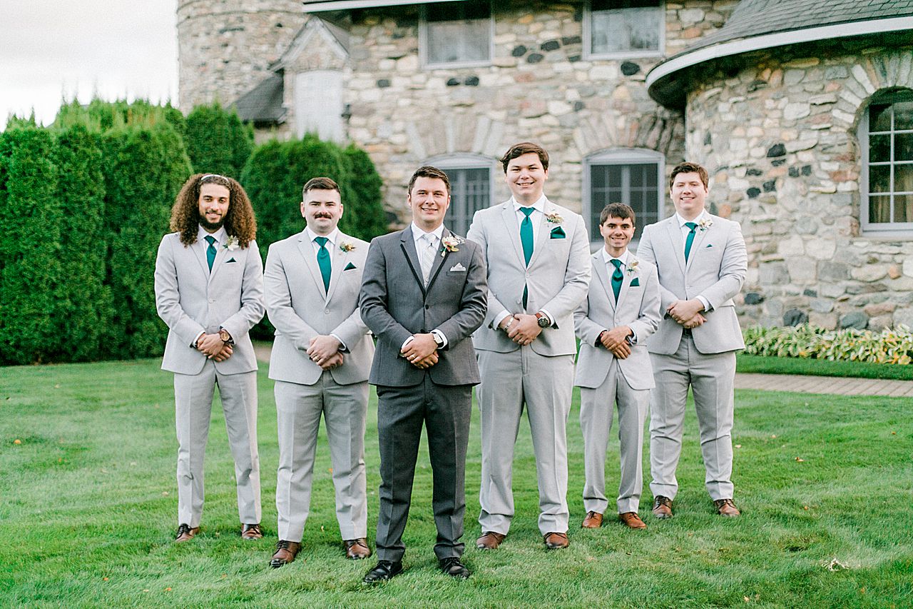 Groom and groomsmen portraits in Charlevoix, Michigan