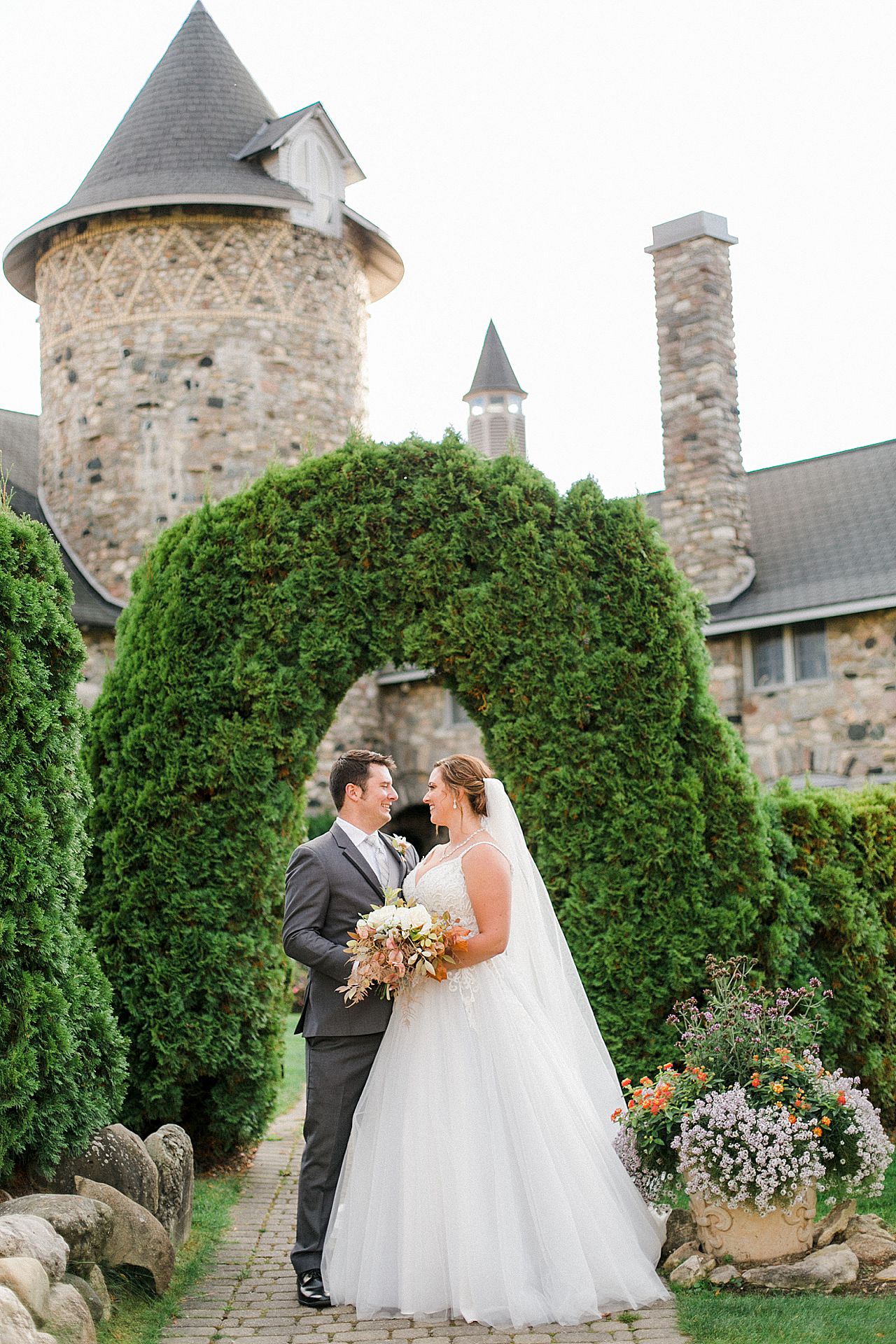 Bride and groom portrait in the butterfly garden at Castle Farms