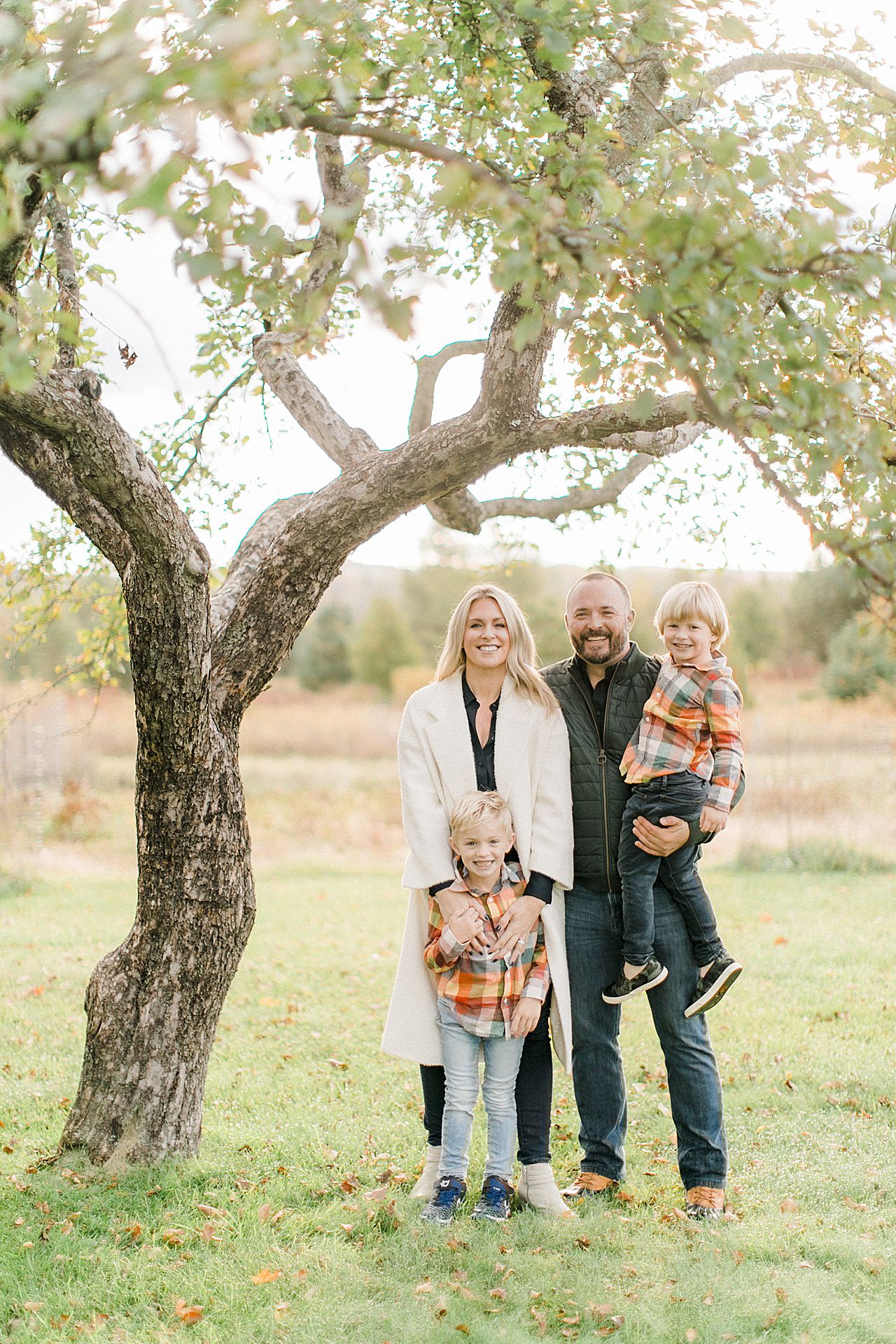 Family portrait of a mother, father, and their 2 boys Petoskey, Michigan